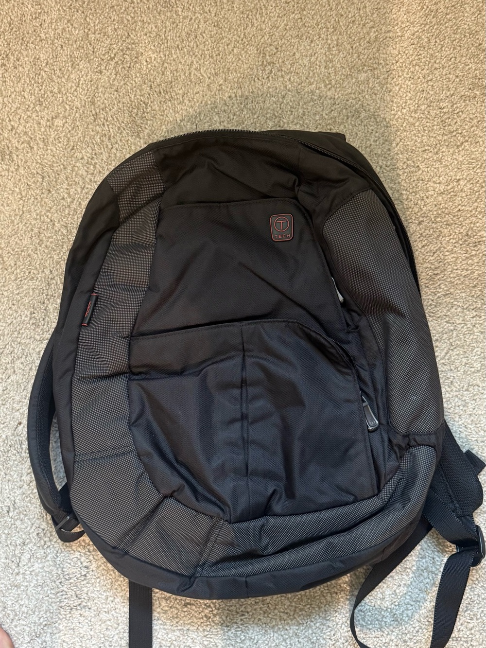 Tumi Black Backpack with Subtle Red Logo